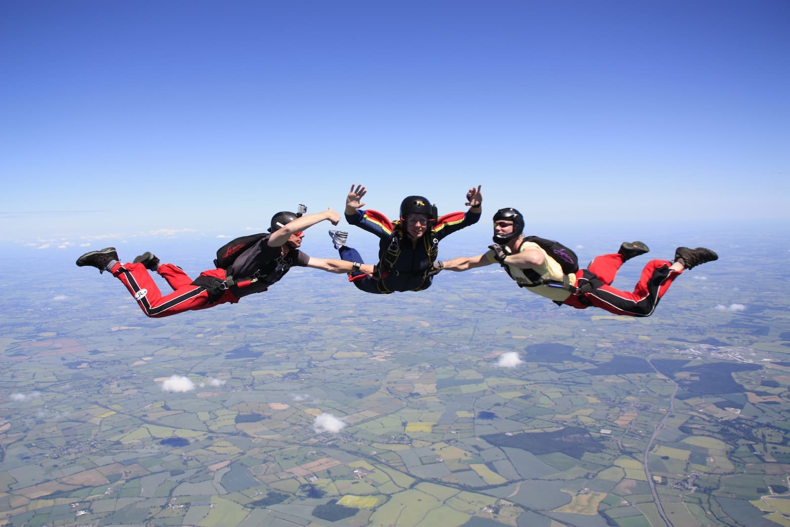 Three people in freefall during a skydive